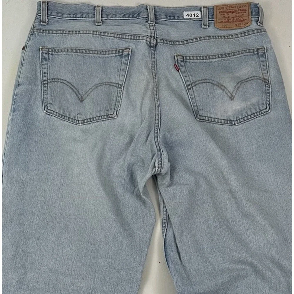 VTG Levi's 560 Comfort Fit 38x34 Tapered Loose Jeans Light Wash Distressed Y2K